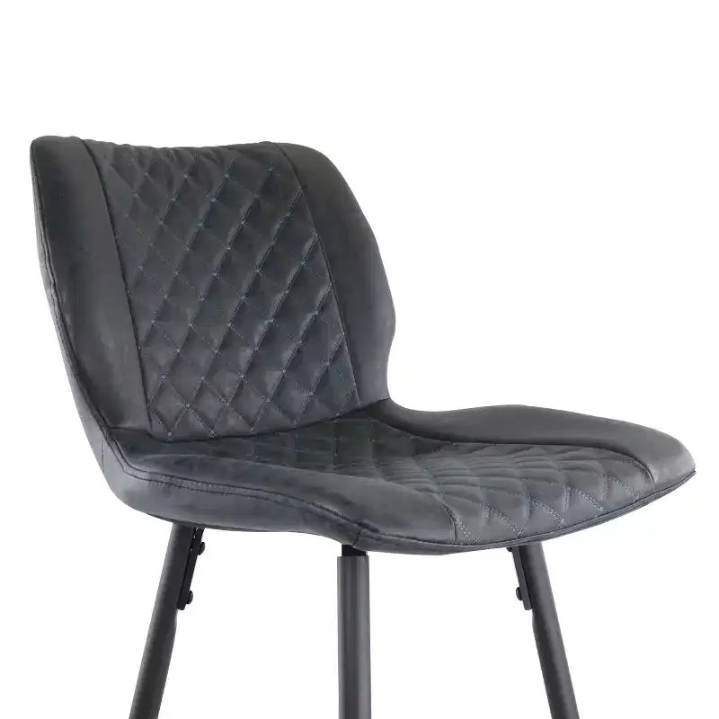 Chaise de bar en similicuir noir surpiqué en losange avec pieds en métal